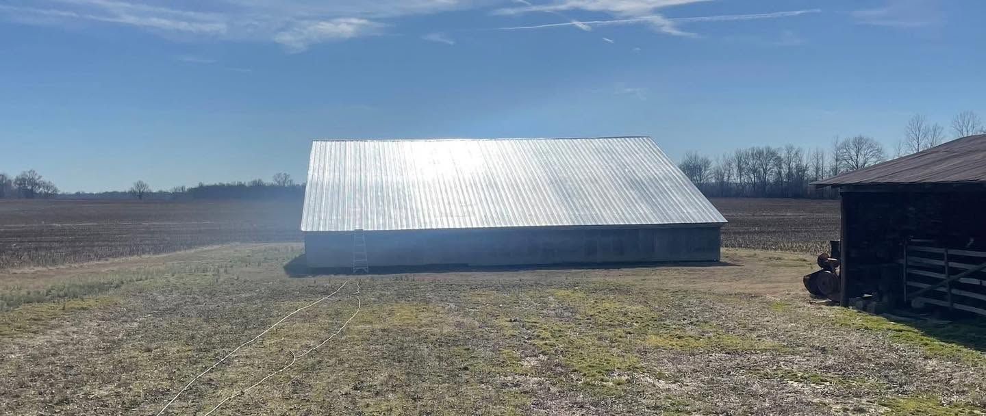 The same field barn with its roof coated bright silver